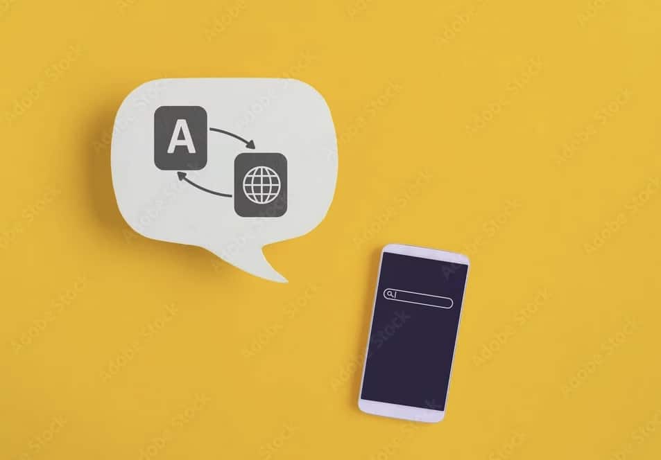 Téléphone portable sur fond jaune avec symbole de la traduction